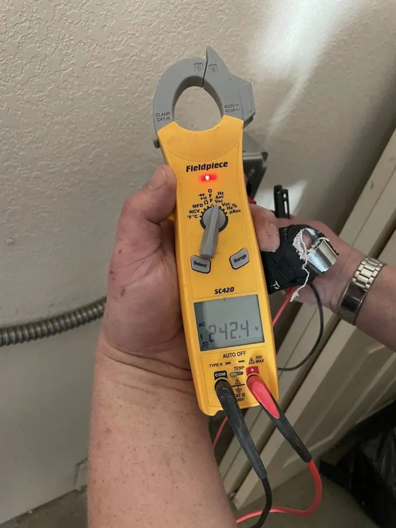 Voltage testing with clamp meter during Whole House Surge Protector in Brownstown